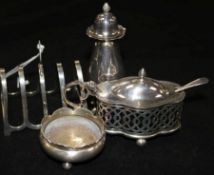 A George V silver lidded mustard pot, pepper pot and toastrack and a plated salt.