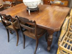 An Edwardian walnut wind-out dining table, one extra leaf, L.147cm extended