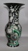 A Chinese famille noir long-necked baluster vase on stand