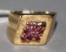 An 18ct gold and ruby cluster cocktail ring, size K.