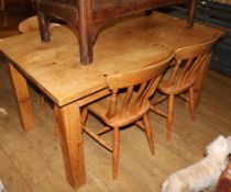 A pine kitchen table and a set of four beech kitchen chairs, 153 x 92cm