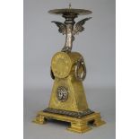 An Empire style ormolu candlestick