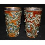 A pair of Doulton silver rim beakers