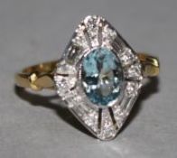 An 18ct gold, aquamarine and diamond ring, of lozenge shape, size O.