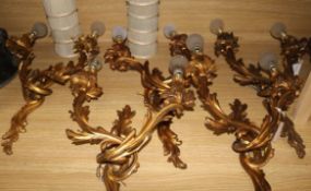 A set of five Louis XV design gilt metal two branch wall lights