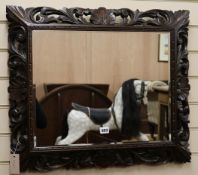 A carved oak frame mirror,