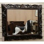 A carved oak frame mirror,