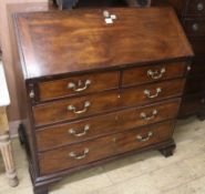 A George III mahogany bureau, on later supports, W.107cm