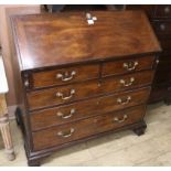 A George III mahogany bureau, on later supports, W.107cm