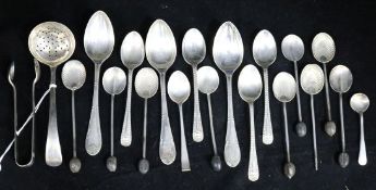 A collection of George III and later silver spoons and sugar tongs