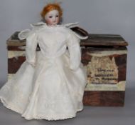 A Continental bisque head automaton doll, late 19th century