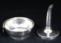 A silver funnel & strainer