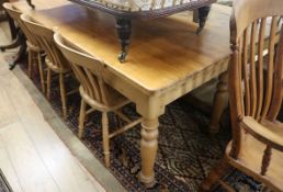 A pine kitchen table fitted single drawer and four slat-back chairs (one with arms), W.213cm