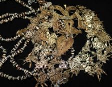 An Indian silver gilt filigree necklace and an Indian silver and bead four string necklace (2)