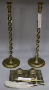 A pair of brass open twist candlesticks and an embossed brass inkwell