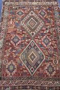 A Shirvan rug, woven two central lozenge within hooked botehs, 173cm x 122cm(worn)