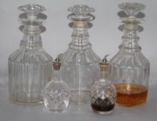 Three mallet shaped decanters and two bitters bottles (5)