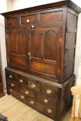 A mid 18th century oak bacon cupboard, W.145cm H.186cm