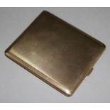 A 1940's engine turned 9ct gold cigarette case, 3.75in.