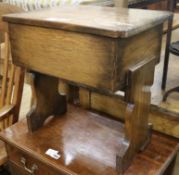 A small oak box topped table