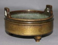 A Chinese bronze tripod censer