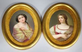 A pair of German oval porcelain plaques depicting maidens, gilt framed