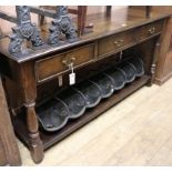 A reproduction oak dresser base, fitted three drawers and pot shelf, W.153cm