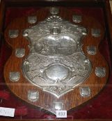 A late Victorian repousse silver mounted oak crown green bowling related presentation shield, of