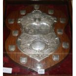 A late Victorian repousse silver mounted oak crown green bowling related presentation shield, of