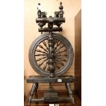 A Victorian ebonised spinning wheel, H.87cm