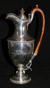 A late Victorian demi fluted silver hot water jug by Walter & John Barnard, London, 1895, 11.75in,