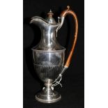 A late Victorian demi fluted silver hot water jug by Walter & John Barnard, London, 1895, 11.75in,