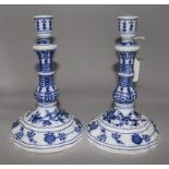 A pair of Meissen onion pattern blue and white candlesticks