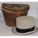 A Victorian top hat, in leather case