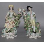 A pair of Derby candlestick figures of flower sellers, c.1770, pad marks, losses