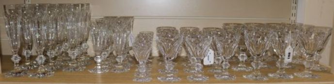 A part suite of Baccarat 'Compiegne' pattern table glass, comprising: a set of three decanters,
