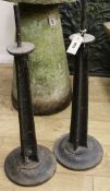 A pair of heavy iron pricket candlesticks, H.74cm