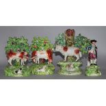 A Walton pottery sheep and lamb spill vase, two Staffordshire pottery cow and calf groups & a