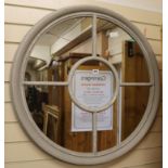 A grey circular panelled mirror, W.88cm