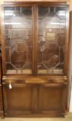 A reproduction brass-bound mahogany glazed bookcase, H.210cm