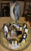 A collection of ceramic penguins