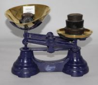 A set of Victorian black painted iron scales, with brass pans and weights