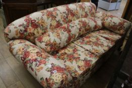 A 1930's scroll end three seater settee, on short cabriole legs, W.210cm