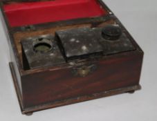 A George III mahogany tea caddy, fitted pewter tea canisters