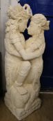 A garden statue of figures embracing, H.125cm