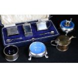 A cased silver three piece condiment set, two silver condiments, a silver stopper, two condiment