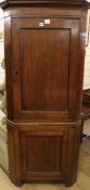 A late 18th century oak standing two door corner cupboard, H.178cm