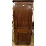 A late 18th century oak standing two door corner cupboard, H.178cm