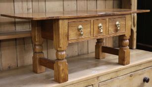 A modern burr wood rectangular topped coffee table, W.99cm