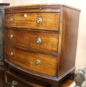 A Regency mahogany bow fronted chest, fitted three long drawers, over a brushing slide W.93cm